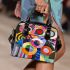Abstract painting of colorful circles and lines shoulder handbag