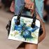 Blue butterfly with white flowers around shoulder handbag