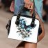 Blue butterfly with white flowers around shoulder handbag