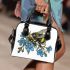 Bumblebee holding a blue forgetmenot flower shoulder handbag