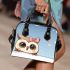 Chibi owl with a pink bow on its head peeking shoulder handbag