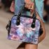 Colored butterfly surrounded by blooming flowers shoulder handbag