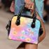 Colorful daisies and butterflies shoulder handbag