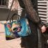 Colorful Hillside Creature Small Handbag