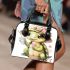 Cute baby turtle is eating ice cream shoulder handbag