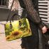 Cute bee sits on the petals of sunflowers small handbag