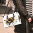 Cute bee sitting on daisy flower small handbag