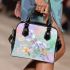 Cute butterfly surrounded by pastel flowers shoulder handbag