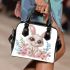 Cute cartoon bunny with big eyes sitting on the flowers shoulder handbag