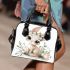 Cute cartoon bunny with big eyes sitting on the flowers shoulder handbag