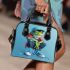 Cute cartoon green frog sitting on top of white sneakers shoulder handbag