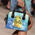 Cute frog wearing a crown sitting on golden ball shoulder handbag