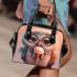 Cute owl with big eyes holding an ice cream shoulder handbag
