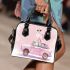 Cute pink owl sitting on top of a pastel car shoulder handbag