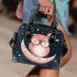 Cute pink owl with a bow and glasses sitting on the moon shoulder handbag