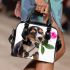 Cute valentine's day beagle puppy holding a pink rose shoulder handbag