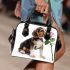 Cute valentine's day beagle puppy holding a pink rose shoulder handbag