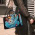Dreamy surrealism woman on a colorful cloud small handbag