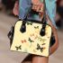 Featuring various butterflies in flight shoulder handbag