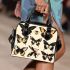 Illustrations with various butterfly silhouettes shoulder handbag