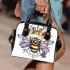 Queen bee with a crown sitting on flower shoulder handbag