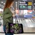 Skull with green frog on top and purple thistles growing 3d travel bag