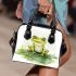 Smiling frog sitting on a pond shoulder handbag