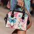 Vibrant pattern of pink and turquoise butterflies shoulder handbag