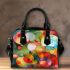 Abstract painting of circles and spheres shoulder handbag