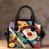 Abstract painting of colorful circles and lines shoulder handbag