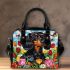 Black and tan dachshund dog surrounded by colorful tulips shoulder handbag