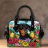 Black and tan dachshund dog surrounded by colorful tulips shoulder handbag