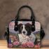 Black and white border collie sits in the foreground amidst blooming flowers shoulder handbag