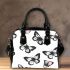Black and white butterfly pattern with pink accents shoulder handbag