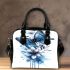 Blue butterfly with white flowers around shoulder handbag