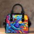 Blue frog with rainbow stripes on his body shoulder handbag