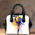 Blue macaw in the style of abstract watercolor shoulder handbag