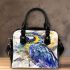 Blue macaw in the style of watercolor and ink shoulder handbag