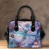 Colored butterfly surrounded by blooming flowers shoulder handbag