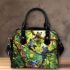 Colorful cartoon frogs hanging from tree branches in the jungle shoulder handbag