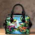 Colorful frogs hanging from tree branches in the jungle shoulder handbag