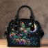 Colorful glowing butterfly surrounded by flowers and leaves shoulder handbag