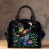 Colorful glowing butterfly surrounded by flowers and leaves shoulder handbag