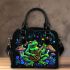 Colorful green frog playing banjo under mushroom shoulder handbag