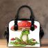 Cute cartoon frog sitting under an amanita muscaria mushroom shoulder handbag