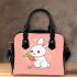 Cute cartoon rabbit playing with a carrot shoulder handbag