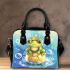 Cute frog wearing a crown sitting on golden ball shoulder handbag