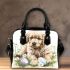 Cute golden retriever puppy with daisies and easter eggs shoulder handbag