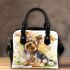 Cute little yorkshire terrier with long hair and bows in her ears shoulder handbag