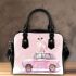 Cute pink owl sitting on top of a pastel car shoulder handbag